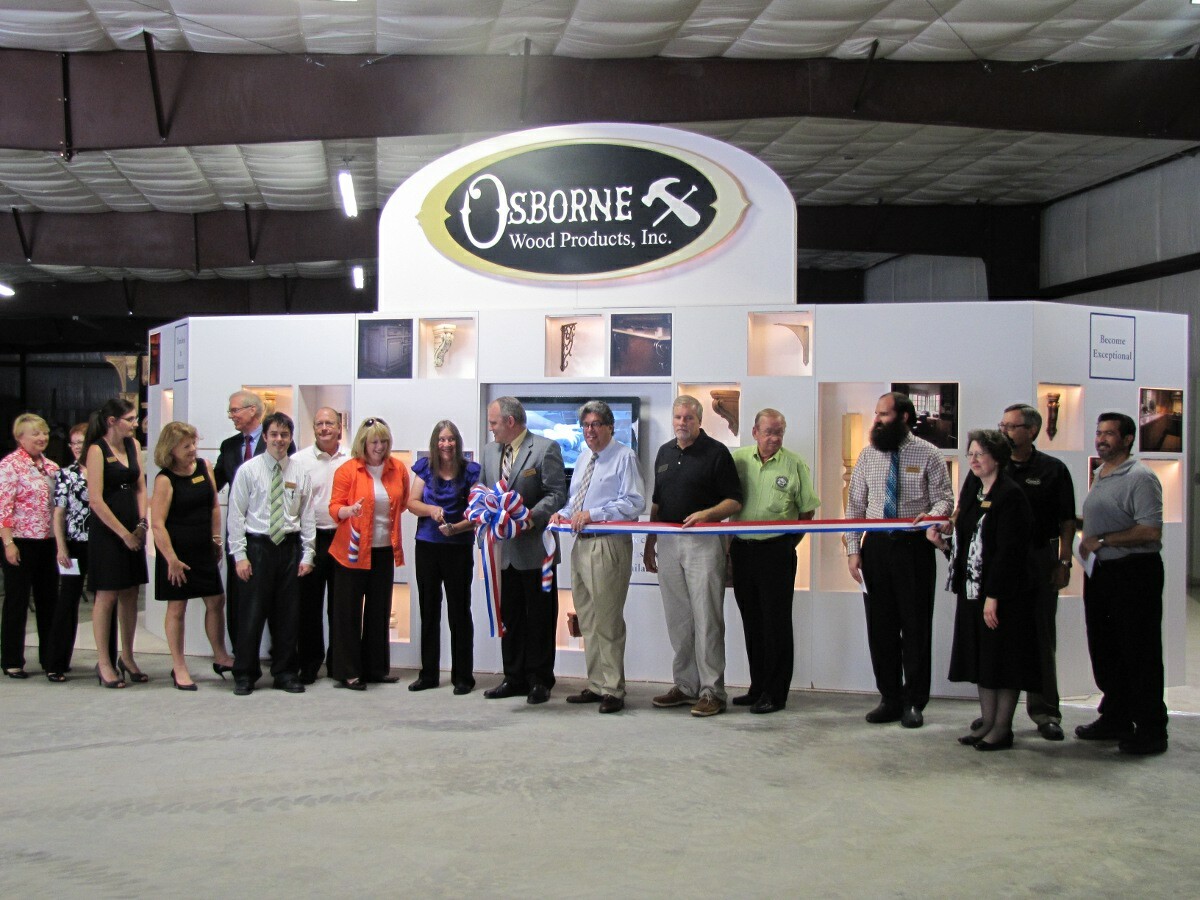 CEO, Leon Osborne, with management team at ribbon cutting